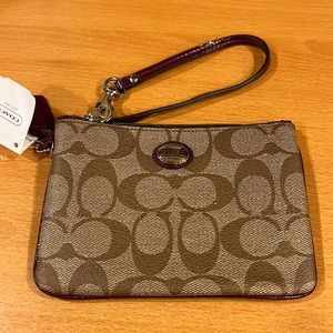 Small Coach wristlet.